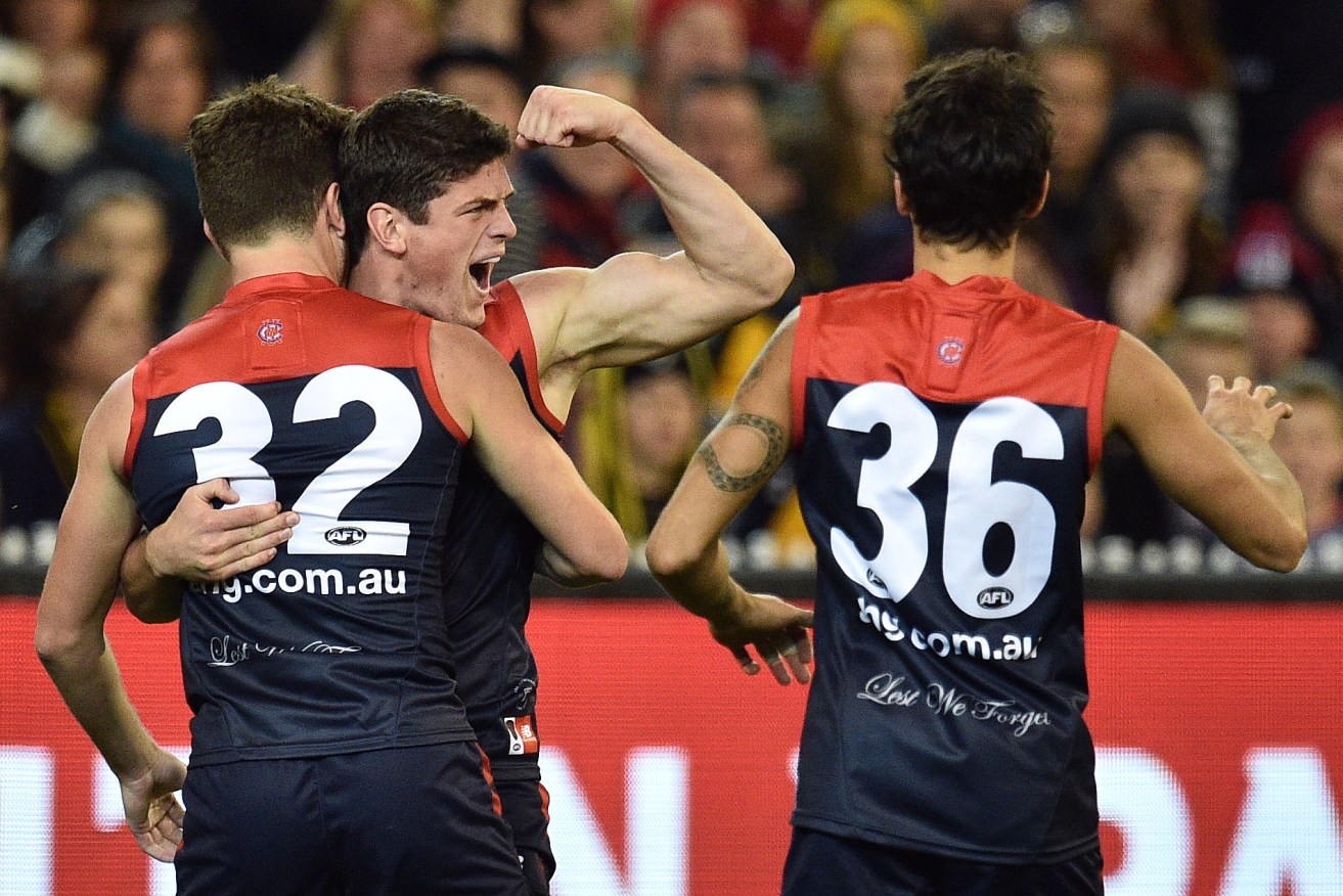Angus Brayshaw joins teammates to celebrate during Melbourne's win over Richmond last weekend. Photo: Julian Smith, AAP.