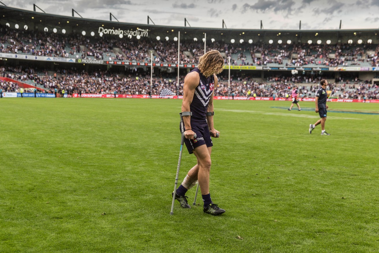 Freo's Brownlow champ Nat Fyfe is out of action after re-injuring his leg last week. Photo: Tony McDonough, AAP.