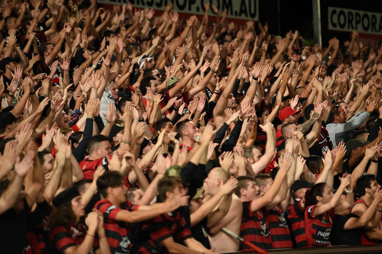 Wanderers supporters celebrate a 2016 victory. Photo: AAP/Dan Himbrechts