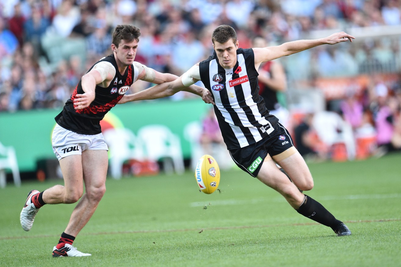 US import Mason Cox flies in as the Magpies dominate Essendon. Photo: Julian Smith, AAP.