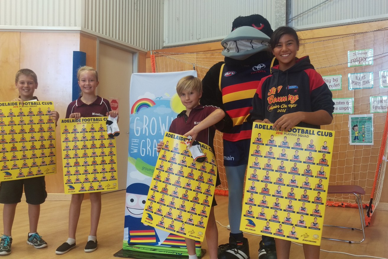 Adelaide mascot 'Claude Crow' joined the club's community arm visiting students from Nicolson Ave Primary School and others.