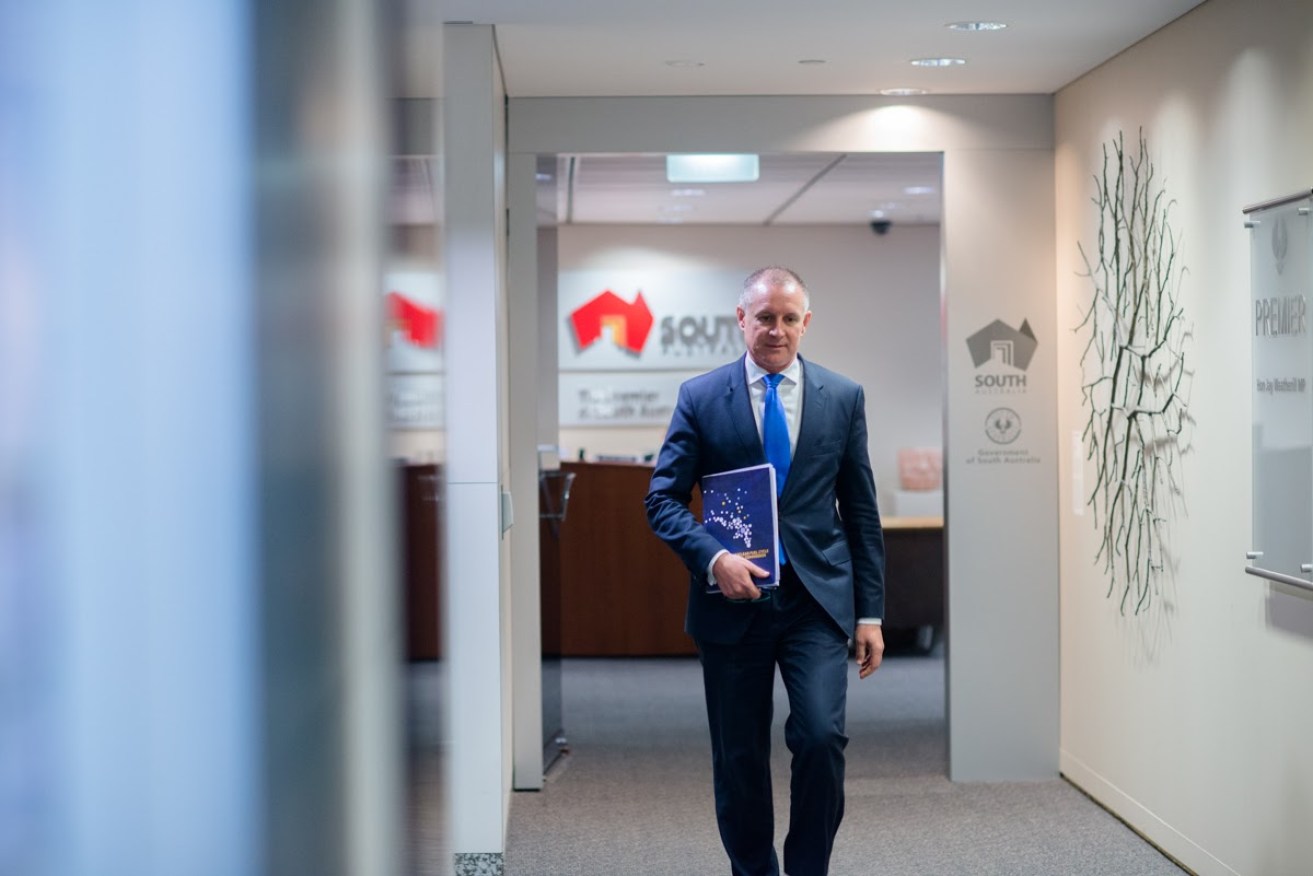 Jay Weatherill brandishing the Nuclear Royal Commission's Final Report. Photo: Nat Rogers, InDaily.