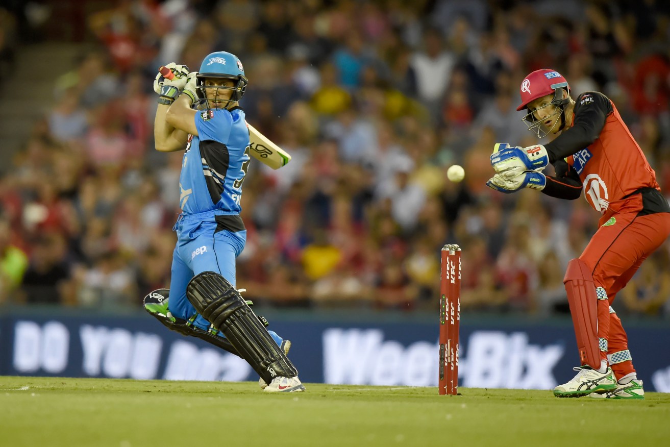 Jake Lehmann cuts the ball past Peter Nevill playing for the Adelaide Strikers in the BBL. Photo: Mal Fairclough, AAP.