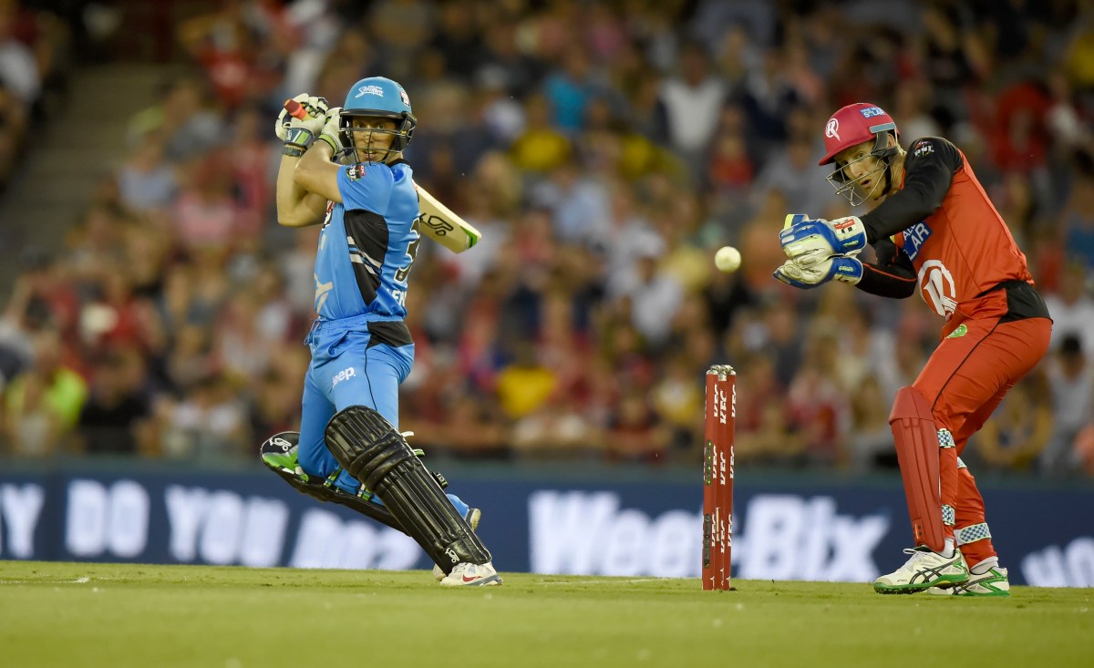 Jake Lehmann cuts the ball past Peter Nevill playing for the Adelaide Strikers in the BBL. Photo: Mal Fairclough, AAP.