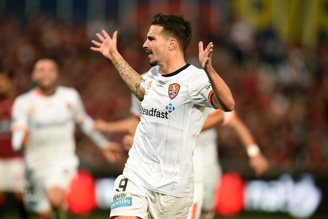 Socceroos squad inclusion Jamie Maclaren celebrates after scoring a goal for the Roar in last mont's classic semi-final against the Western Sydney Wanderers. Photo: Dan Himbrechts, AAP.