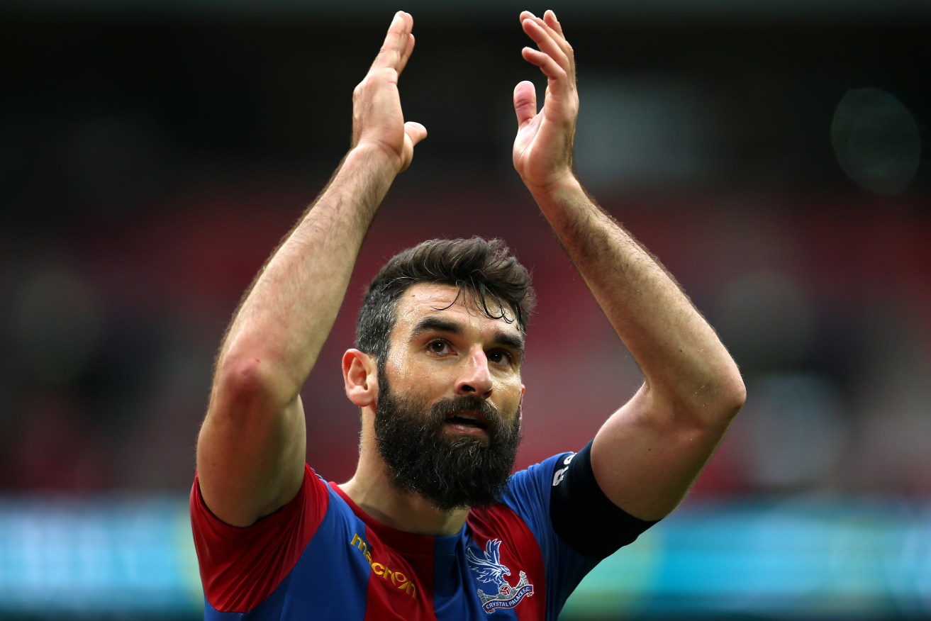 Mile Jedinak applauds supporters after the final whistle during the FA Cup semi-final. Photo: Steve Paston, PA Wire. 