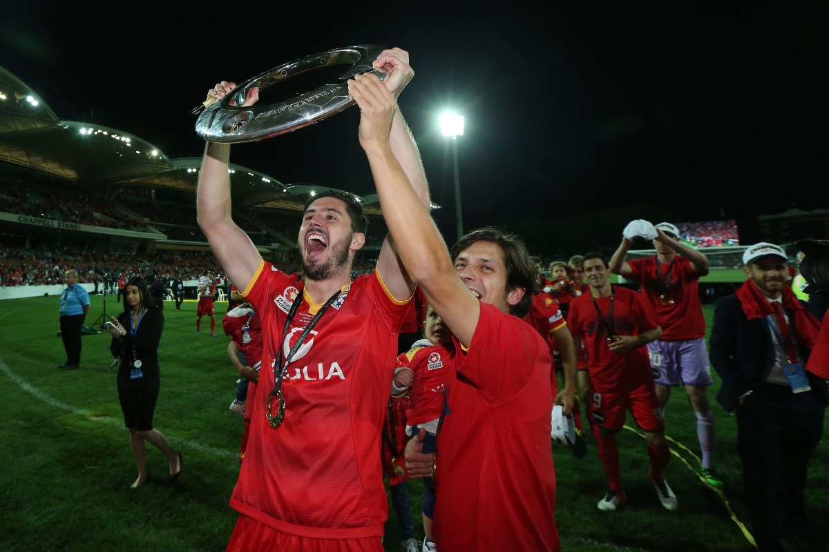 Dylan McGowan and Pablo Sanchez of United celebrate their win during the A-League Grand Final between Adelaide United and the Western Sydney Wanderers at Adelaide Oval in Adelaide, Sunday, May 1, 2016. (AAP Image/James Elsby) NO ARCHIVING, EDITORIAL USE ONLY