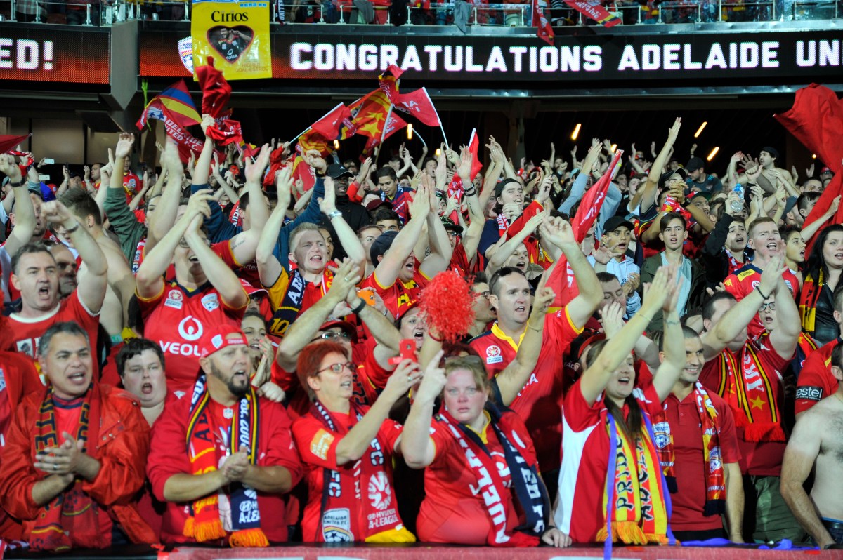 United supporters are jubilant after victory in the A-League Grand Final between Adelaide United and the Western Sydney Wanderers at Adelaide Oval in Adelaide, Sunday, May 1, 2016. (AAP Image/David Mariuz) NO ARCHIVING, EDITORIAL USE ONLY