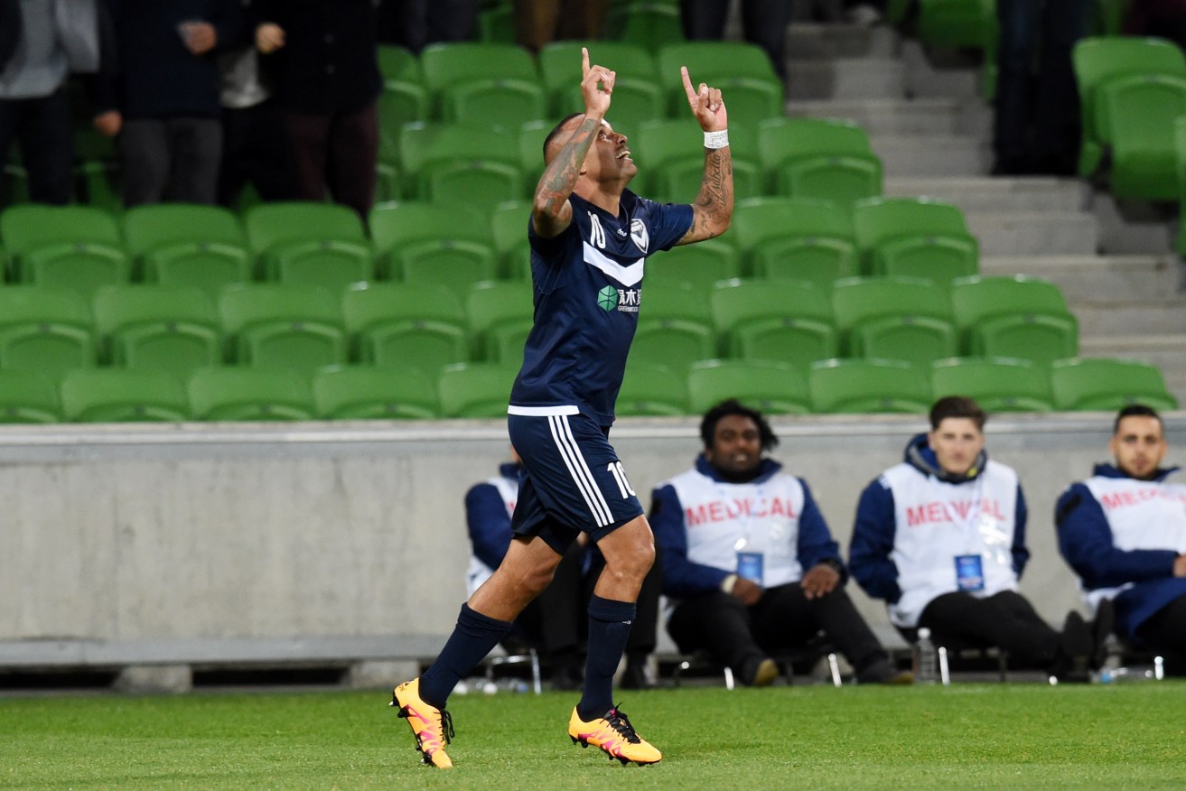 Archie Thompson celebrates after scoring Victory's second goal against Gamba Osaka. Photo: Tracey Nearmy, AAP.