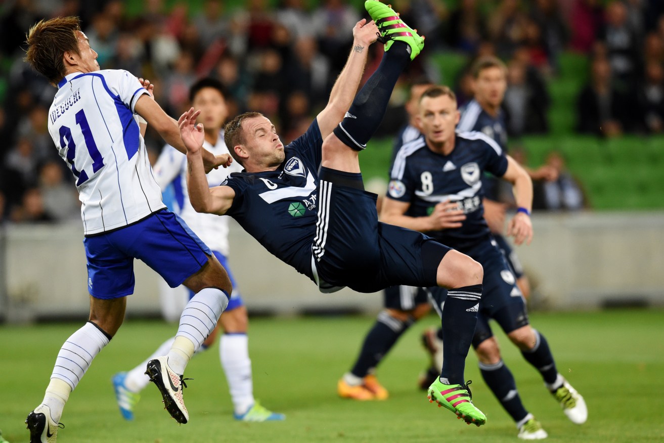 Leigh Broxham of the Victory attempts a scissor kick at goal. Photo: Tracey Nearmy, AAP.