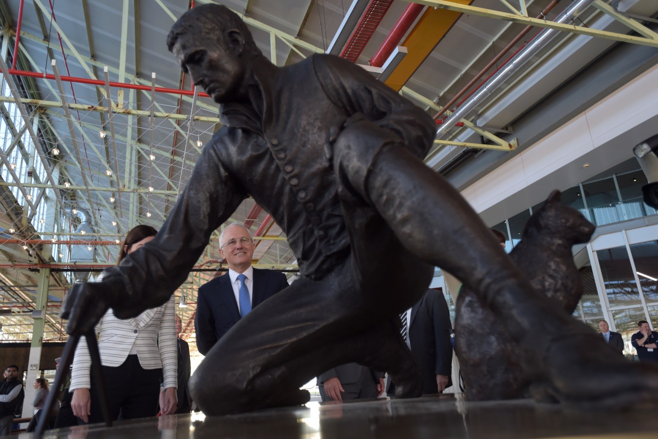 Prime Minister Malcolm Turnbull (centre) unveils a statue of Matthew Flinders at Flinders University today. Photo: AAP/Lukas Coch