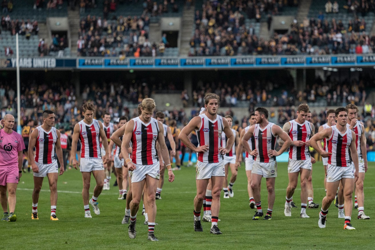 Nick Riewoldt leads his team from the ground after a drubbing at the hands of West Coast. Photo: Tony McDonough, AAP.