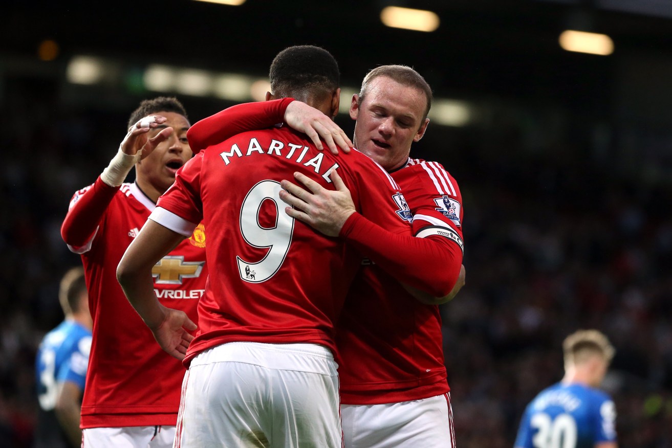 Wayne Rooney celebrates scoring his side's first goal at Old Trafford. Photo: Martin Rickett, PA Wire. 