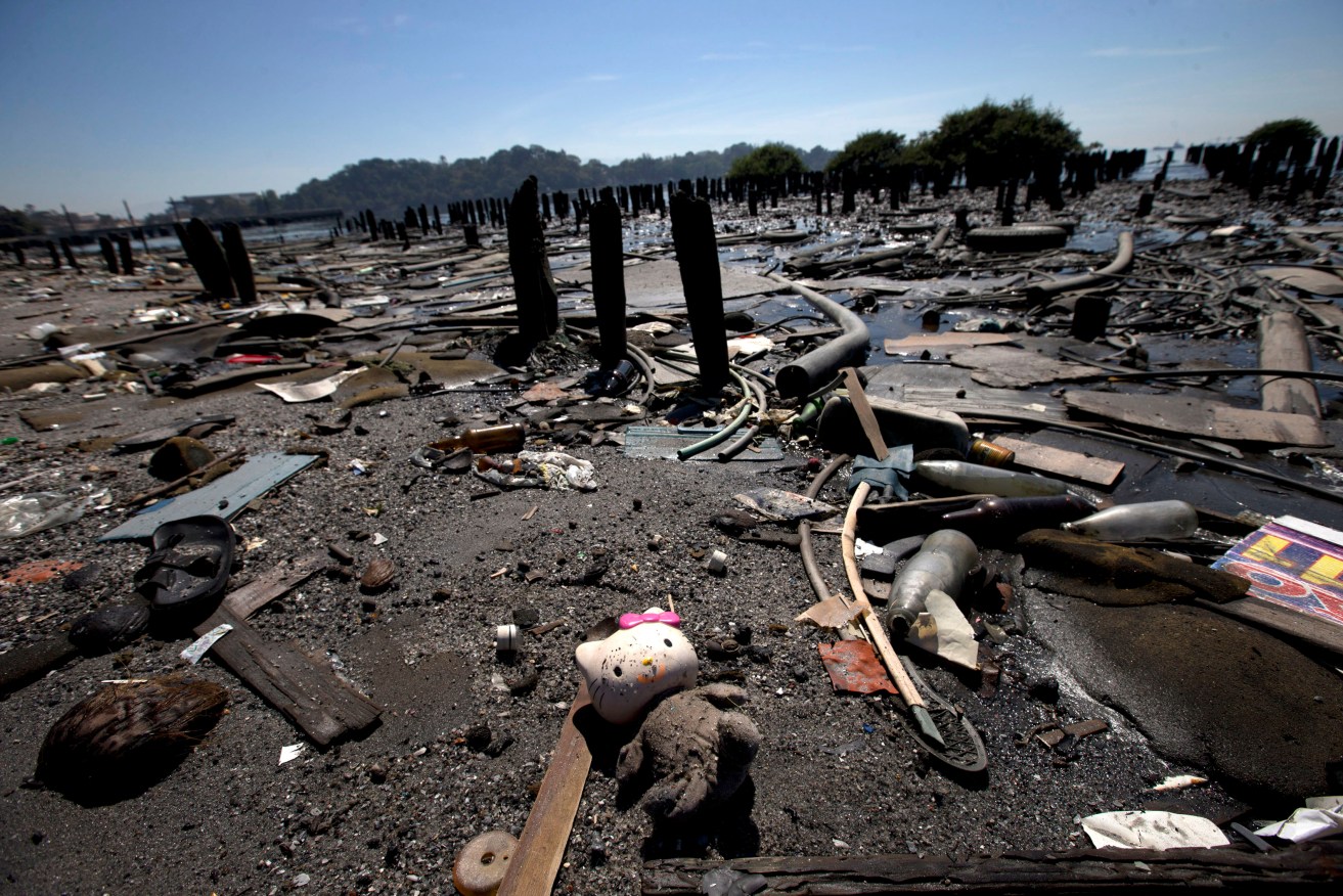 Rio state officials have acknowledged a genuine cleanup of Guanabara Bay will take 20 years, with the city still pouring at least half of its untreated sewage into its surrounding waters. Photo: Silvia Izquierdo, AP.