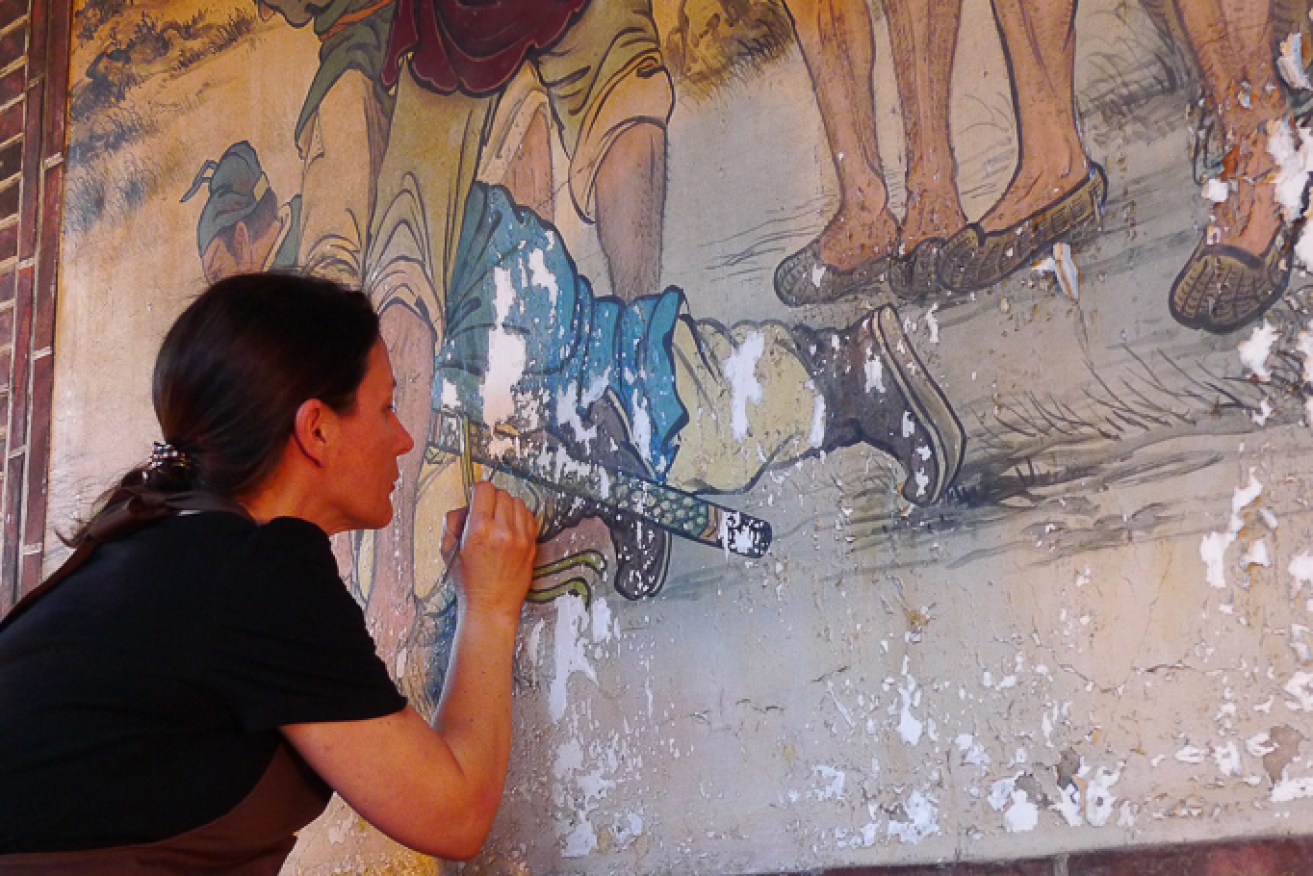 Artlab paintings conservator Rita Costabile working on a fresco at Baon Temple, Taipei City, Taiwan.
