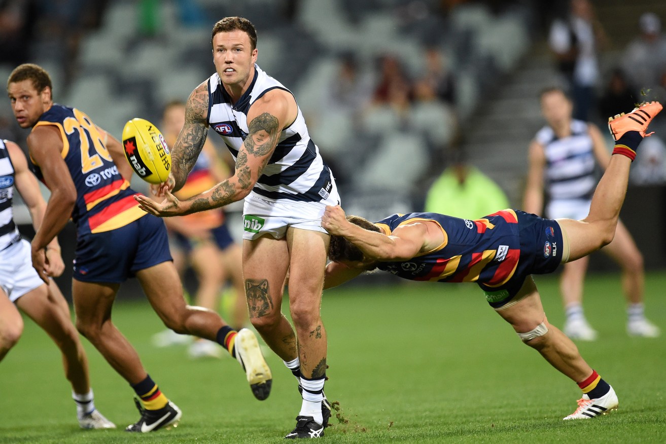 Mitch Clark takes on the Crows during last year's NAB Challenge. Photo: Julian Smith, AAP.