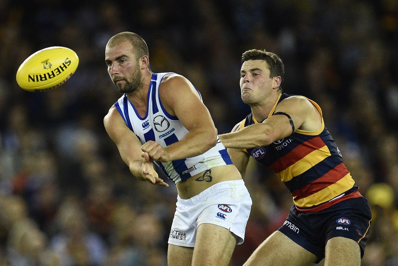 Brad Crouch and Ben Cunnington are both inclusions when the Crows take on the Kangaroos, who defeated Adelaide in Round One. Photo: Julian Smith, AAP.