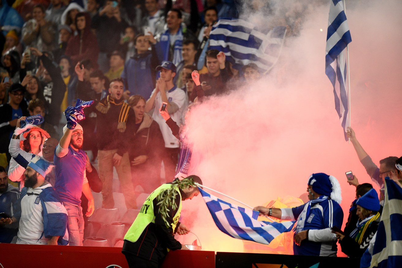 The FFA has vowed to crack down on misbehaving supporters after flares were lit during this week's friendlies against Greece. Photo: Dan Himbrechts, AAP.