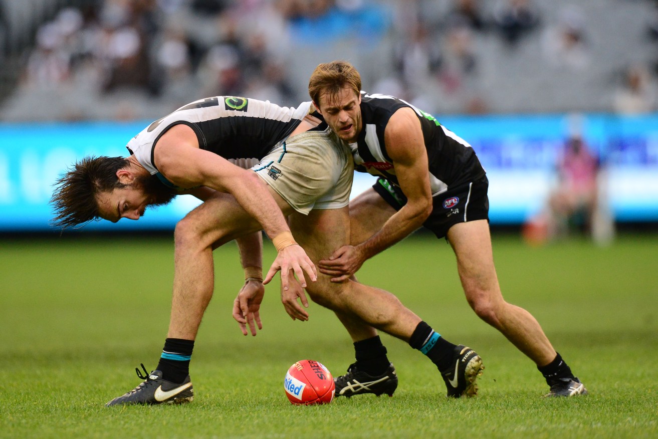 Charlie Dixon and Alan Toovey clash during the Power's win over Collingwood. Photo: Mal Fairclough, AAP.