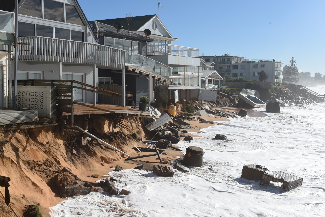 Damaged beachfront homes along Pittwater Road at Collaroy. Photo: AAP/Dean Lewins