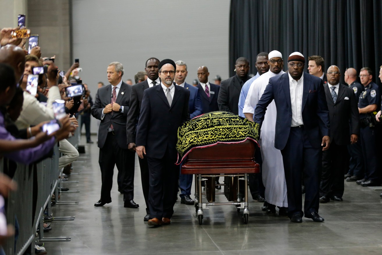 Muhammad Ali's casket arrives at Freedom Hall for his Jenazah, a traditional Islamic Muslim service, in Louisville. Photo: AP/David Goldman)