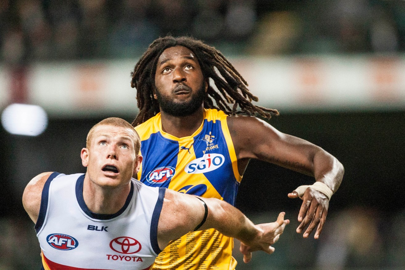 Nic Naitanui and Adelaide's Sam Jacobs contest the ruck during the Crows' win in the West. Photo: Tony McDonough, AAP.