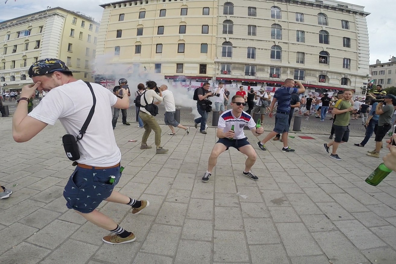 Screen grab taken from a video of football fans as they clash with police in Marseille. Photo: Tom White, PA Wire.
