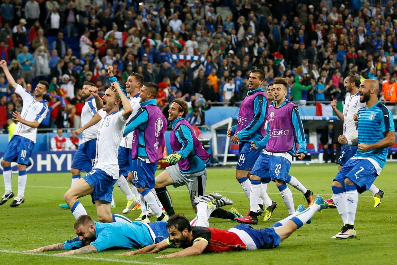 Italian players celebrate their win over Belgium. Photo: SERGEY DOLZHENKO, EPA.