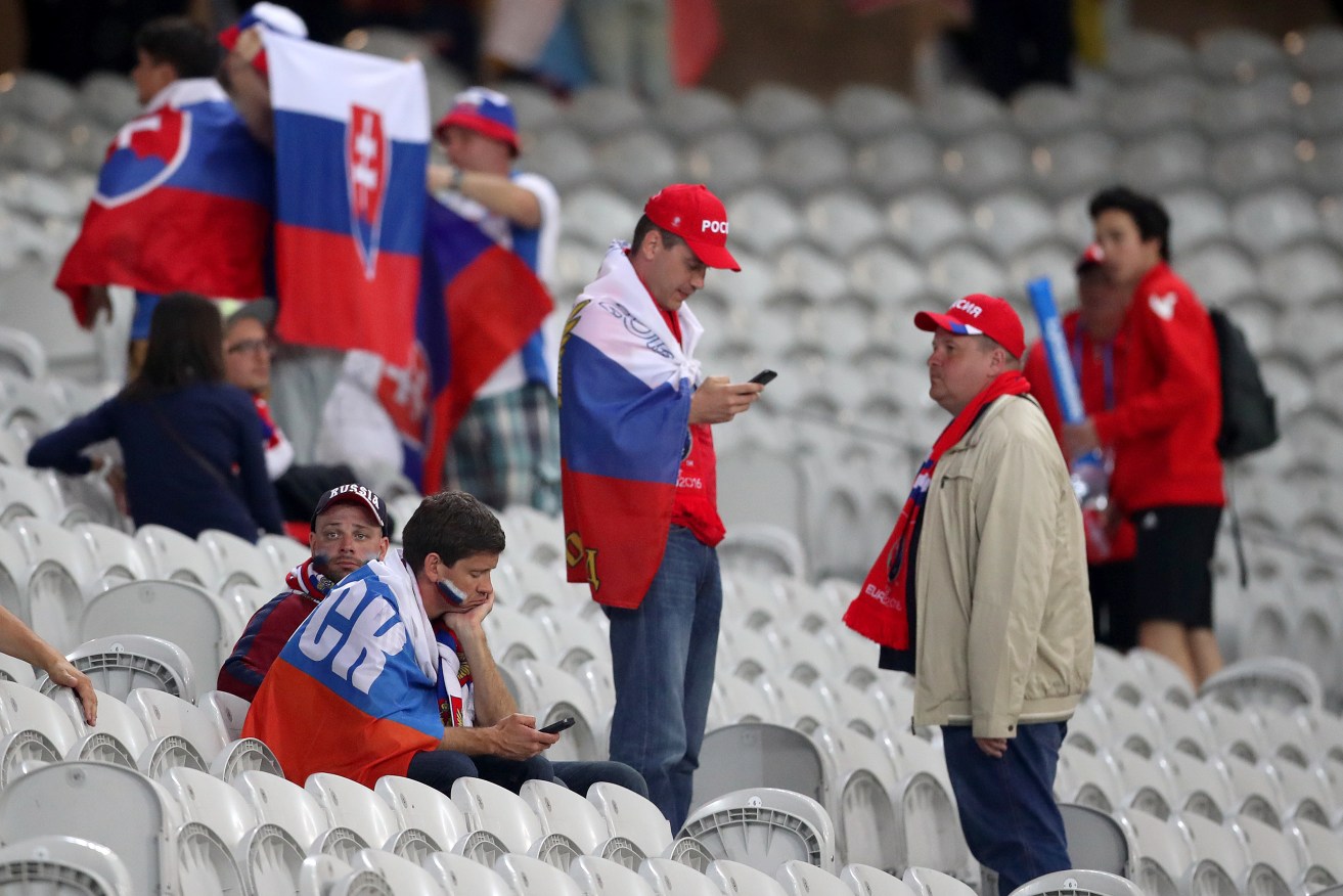 Dejected Russian fans after their team's loss to Slovakia. 