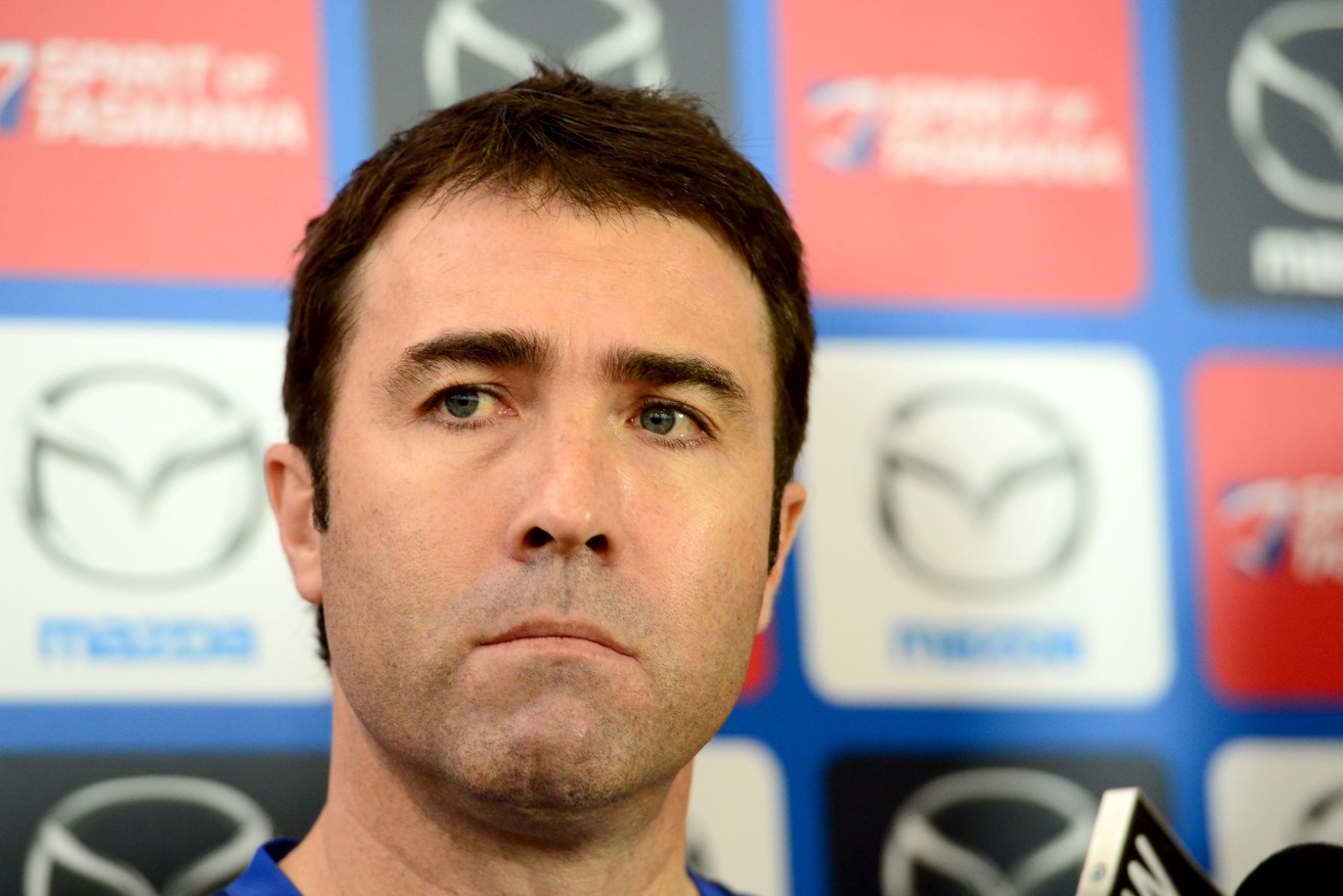 North Melbourne coach Brad Scott addressing the media yesterday. Photo: Mal Fairclough, AAP.