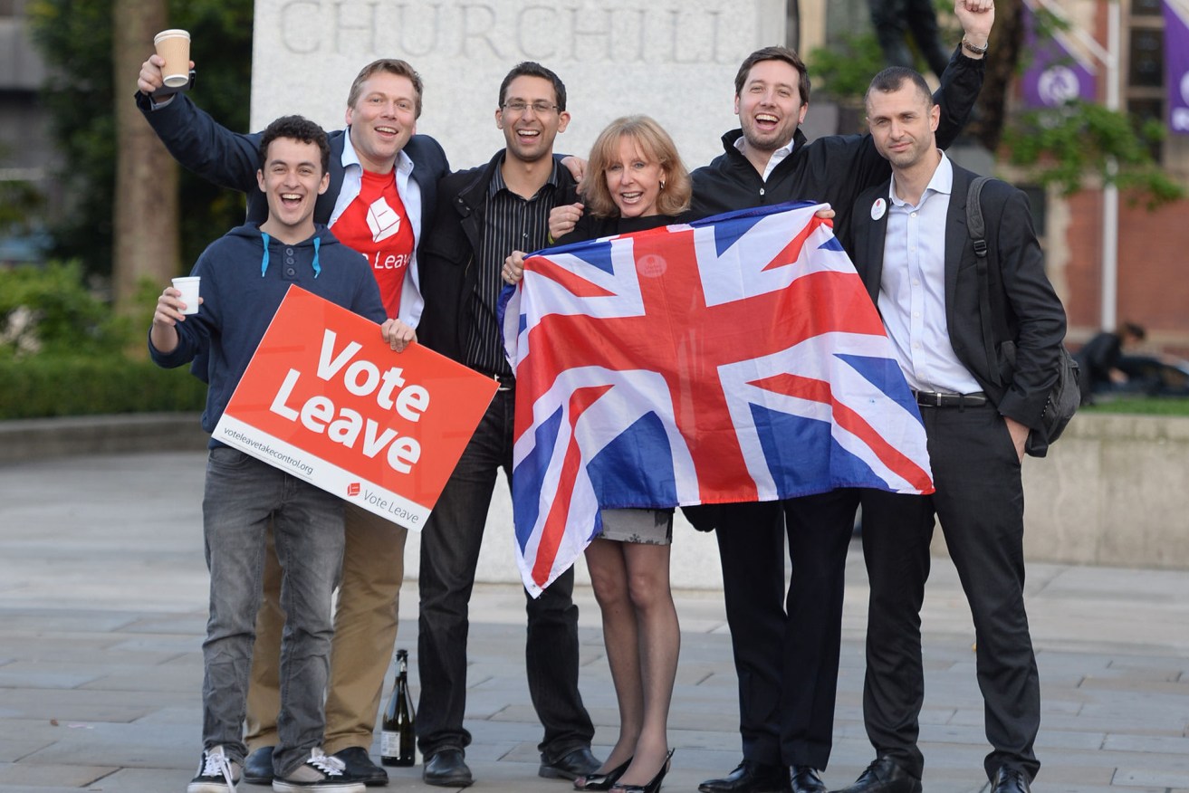 Leave supporters celebrate opposite the Houses of Parliament in London after voters in the referendum backed the campaign for the UK to leave the EU. Photo: Anthony Devlin, PA Wire