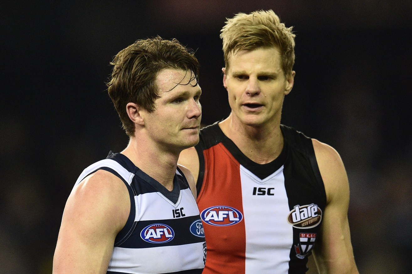 A despondent Patrick Dangerfield gets a word from St Kilda's Nick Riewoldt after Saturday's shock loss. Photo: Julian Smith, AAP.