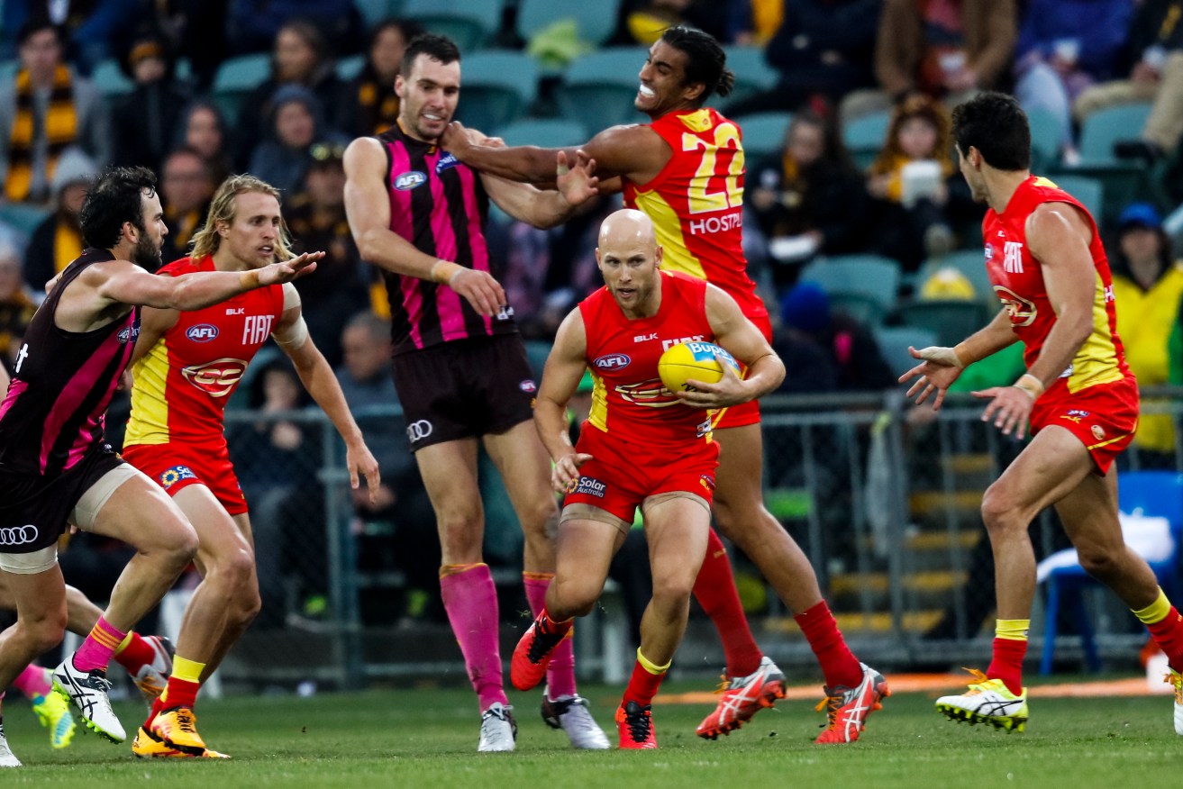 Gary Ablett turned back the clock with 40 possessions and a goal against the Hawks yesterday. Photo: Rob Blakers, AAP.