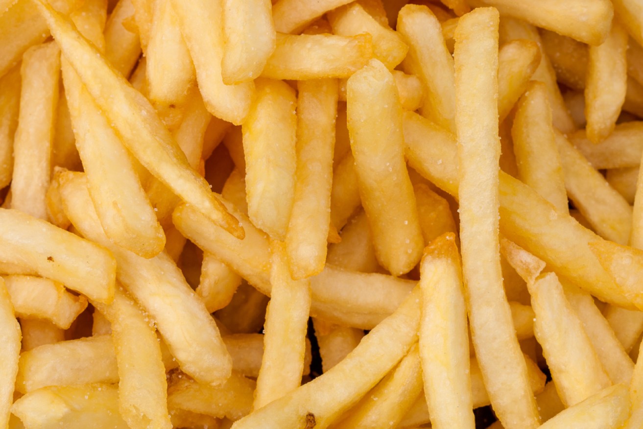 A bucket of chips contains around 275mg of sodium, which accounts for 16 per cent of an adult’s daily limit. Photo: Darkkong/Shutterstock