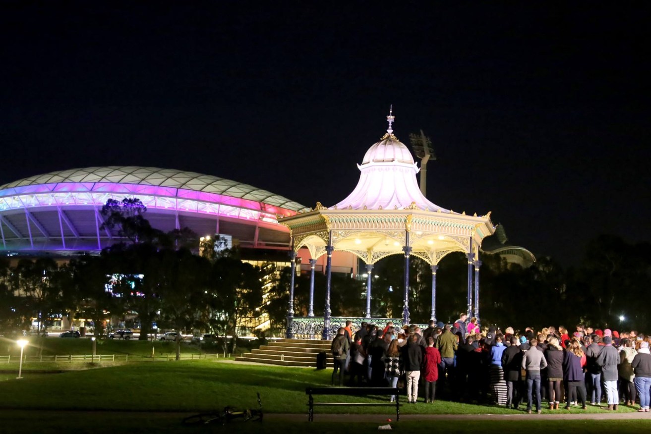 Adelaide Oval is lit up in rainbow colours last night during a vigil at Elder Park. Photo: Facebook.