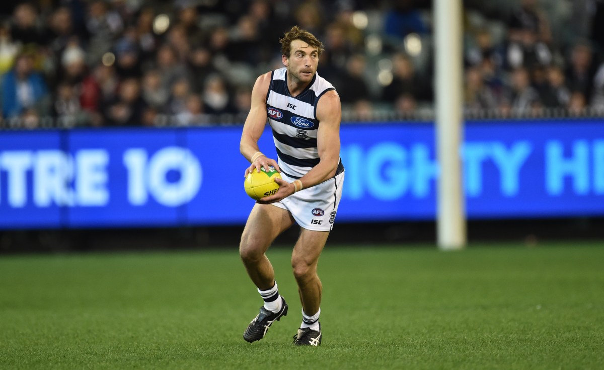 Geelong Cats player Corey Enright possess the ball against the Collingwood Magpies in round 22 of the AFL at the MCG in Melbourne, Friday, Aug. 28, 2015. (AAP Image/Julian Smith) NO ARCHIVING, EDITORIAL USE ONLY