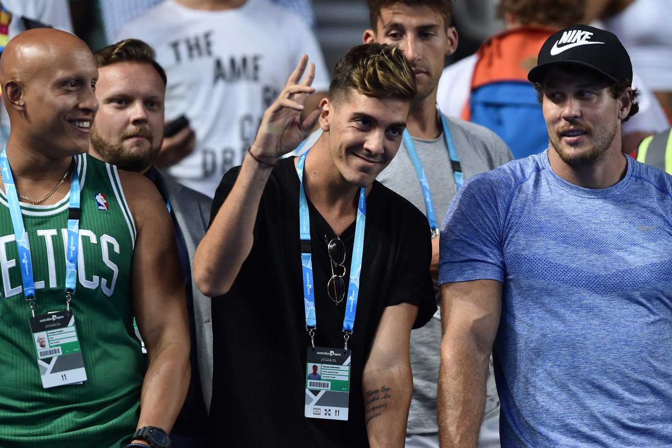 Sidelined Thanasi Kokkinakis watching Nick Kyrgios play in the Australian Open in January. Photo: Julian Smith, AAP.