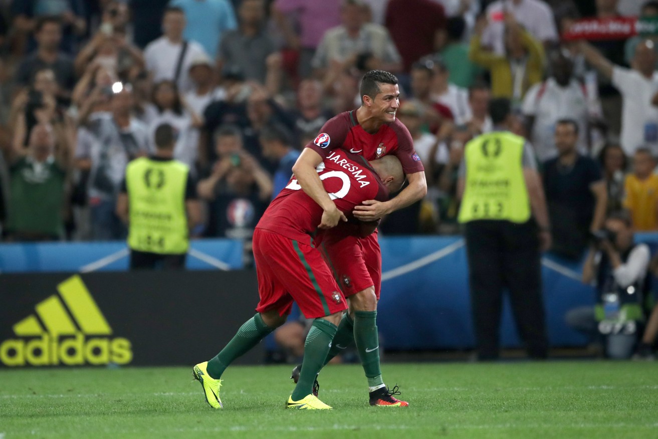 Portugal's Ricardo Quaresma and Cristiano Ronaldo celebrate after the penalty shootout. Photo via AAP