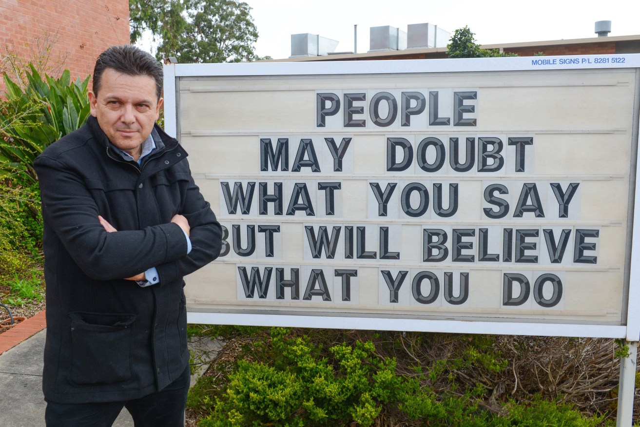 A MESSAGE FROM ON HIGH? Independent Senator Nick Xenophon outside a polling booth at a church in Glynde yesterday. Photo: Brenton Edwards, AAP.