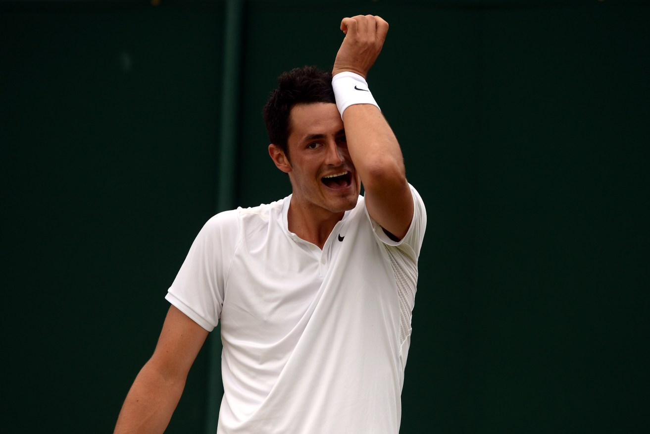 Bernard Tomic in action against Lucas Pouille. Photo: Anthony Devlin, PA Wire. 