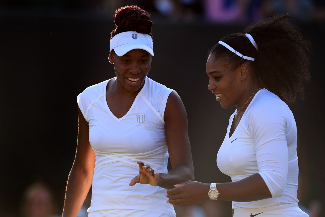 Venus and Serena Williams - seen here winning their doubles match together - may yet face each other in another Wimbledon singles final. Photo: John Walton, PA Wire. 