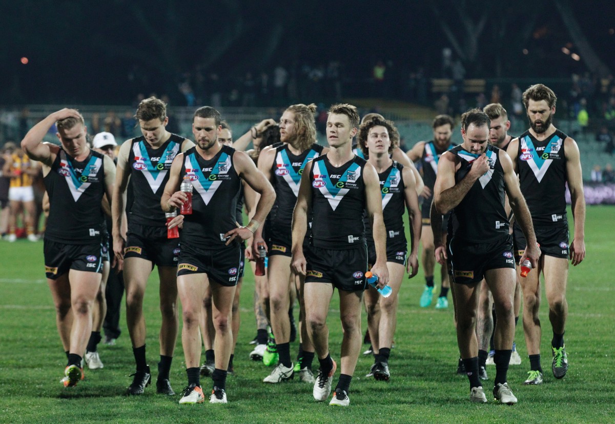 Power players leave Adelaide Oval dejected after their team lost to the Hawks during the Round sixteen AFL match between Port Adelaide Power and the Hawthorn Hawks at Adelaide Oval in Adelaide, Thursday, July 7, 2016. (AAP Image/Ben Macmahon) NO ARCHIVING, EDITORIAL USE ONLY