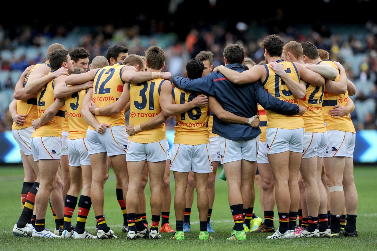 The Crows prepare themselves for yesterday's match against Carlton. Photo: Joe Castro, AAP.