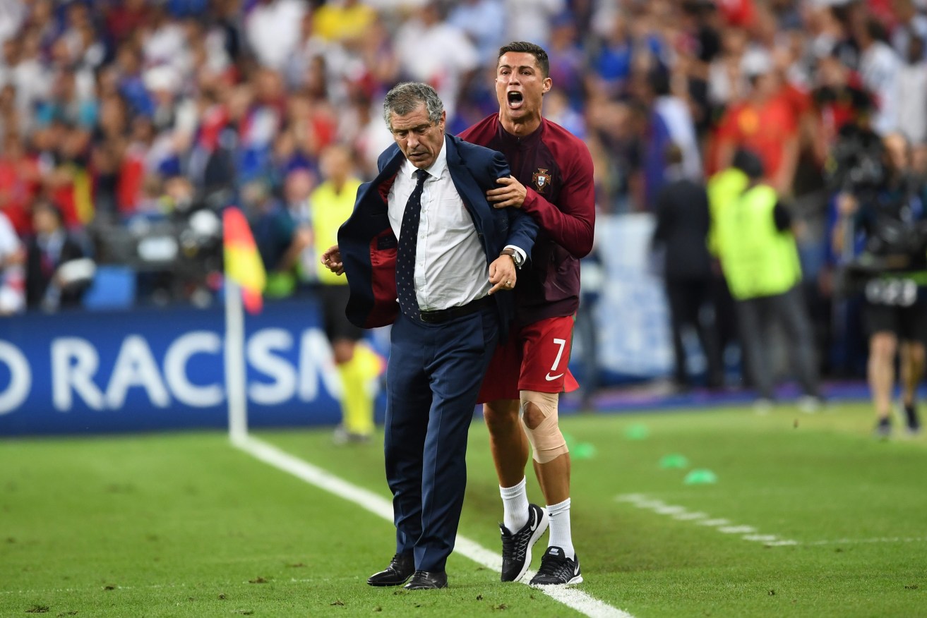 Injured Portugal captain Cristiano Ronaldo reacts to the win with coach Fernando Manuel Costa Santos. Photo: GEORGI LICOVSKI, EPA.