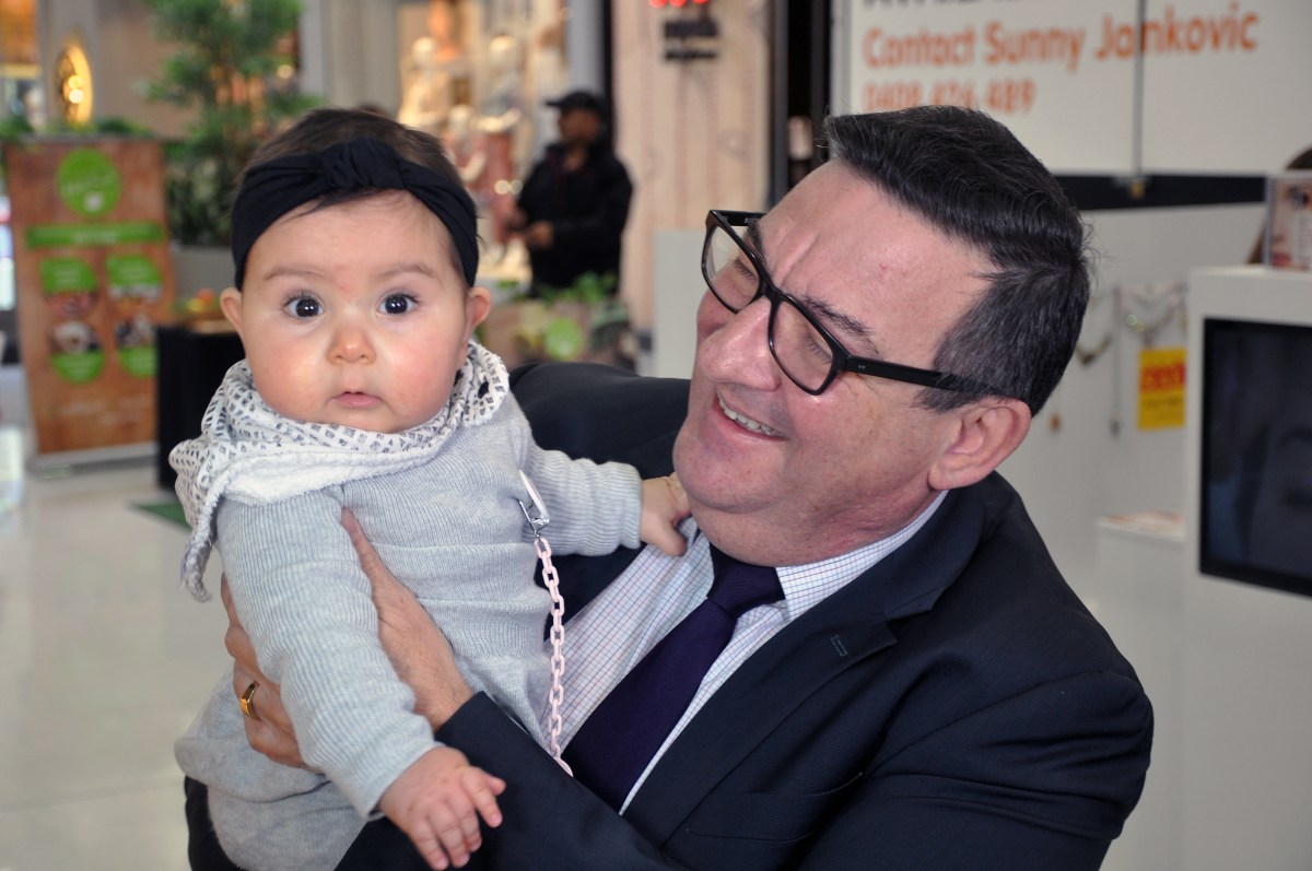 Incoming federal member for Hindmarsh Steve Georganas holds his seven-month-old granddaughter Lia during a visit to a shopping centre with Leader of the Opposition Bill Shorten in the federal seat of Hindmarsh in Adelaide, Wednesday, July 13, 2016. Federal Labor has claimed victory in the South Australian seat of Hindmarsh, with Georganas having a 582-vote lead over sitting Liberal member Matt Williams. (AAP Image/Michael Ramsey) NO ARCHIVING