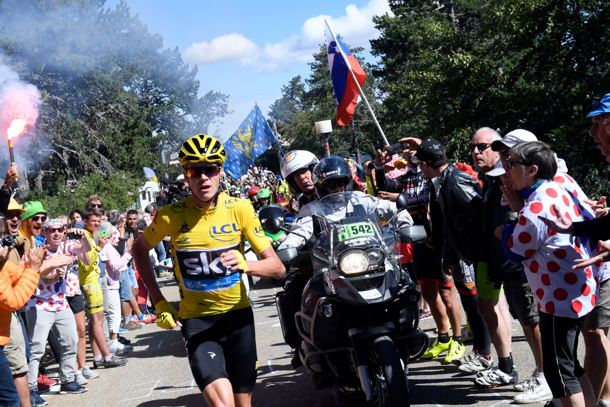 Chris Froome, wearing the overall leader's yellow jersey, runs after he crashed at the end of the twelfth stage of the Tour de France. Photo: Stephane Mantel, Pool Photo via AP.