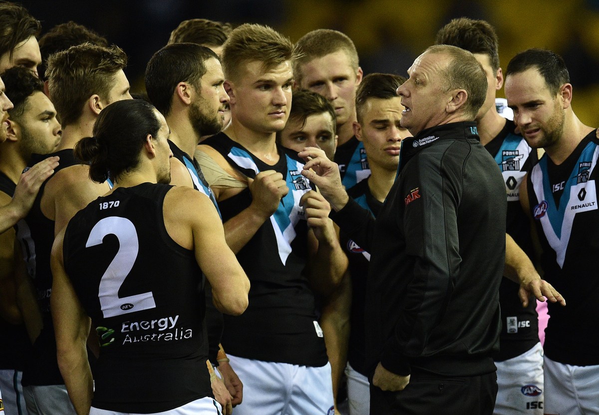 Ken Hinkley coach of the Port Power (second from right) player is seen in during the Round 17 AFL match between the North Melbourne Kangaroos and Port Adelaide Power at Etihad Stadium in Melbourne, Saturday, July 16, 2016. (AAP Image/Julian Smith) NO ARCHIVING, EDITORIAL USE ONLY