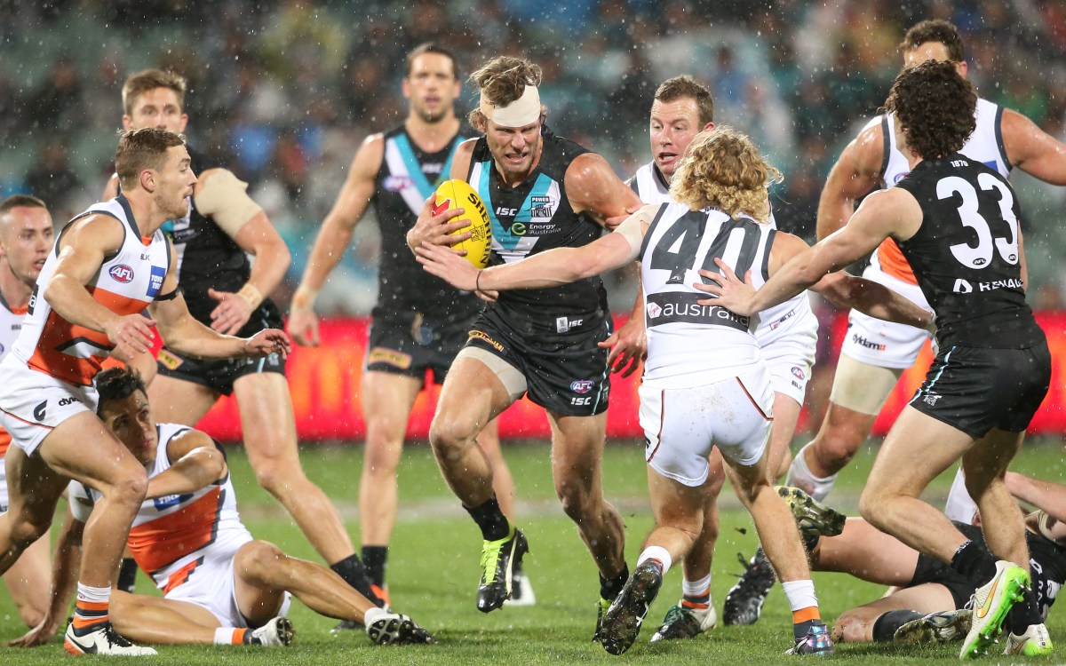 Brad Ebert of the Power looks to step around Adam Kennedy of the Giants during the Round 18 AFL match between Port Adelaide Power and the Greater Western Sydney Giants at Adelaide Oval, Sunday, July 24, 2016. (AAP Image/Ben MacMahon) NO ARCHIVING, EDITORIAL USE ONLY