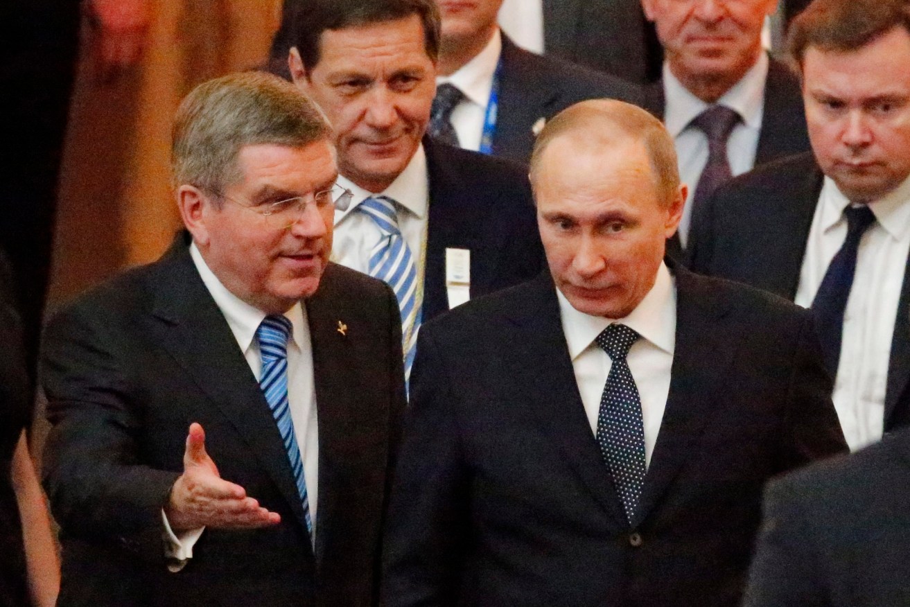 IOC President Thomas Bach with Russian President Vladimir Putin in 2014. Photo: ANATOLY MALTSEV, EPA.