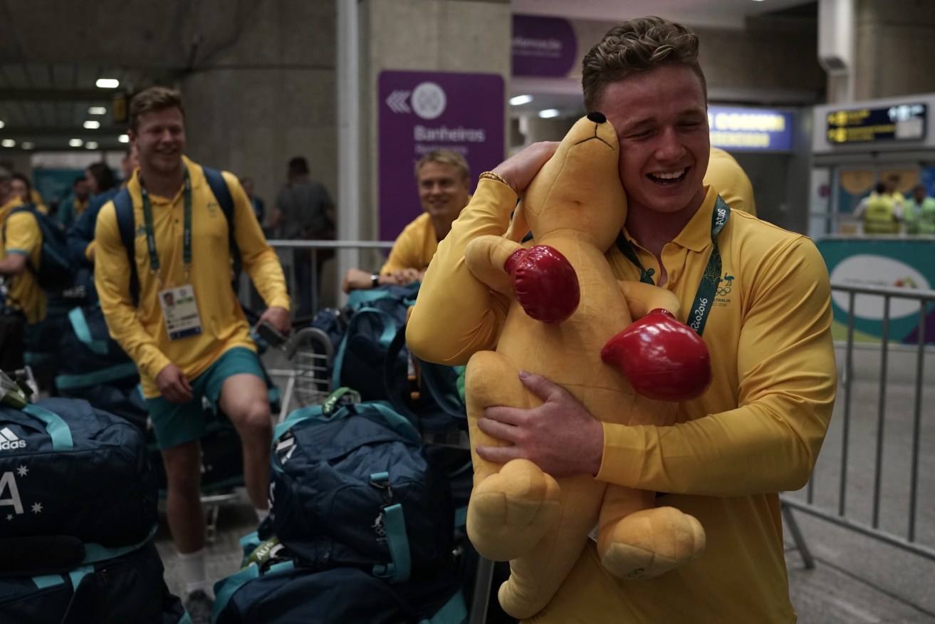 Rugby player Henry Hutchison arrives at the Tom Jobim international airport overnight as the Australian athletes move into the Olympic Village. Photo: Leo Correa, AP.